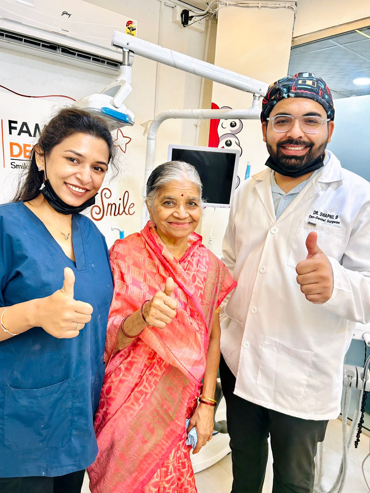Dr. Swapnil Bade with happy patient giving thumbs up