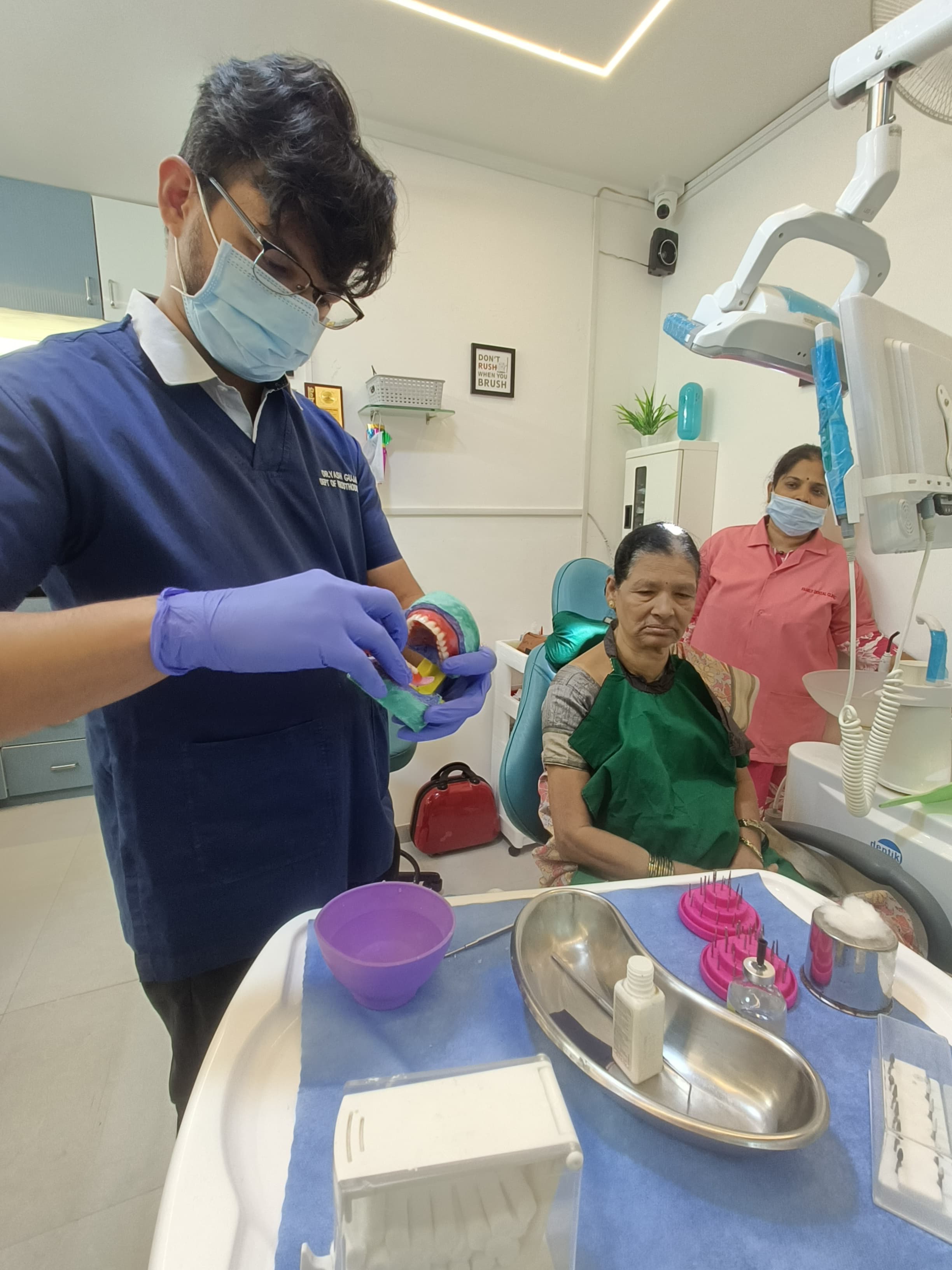 Dentist explaining treatment to patient at Family Dental Clinic Ravet Kiwale